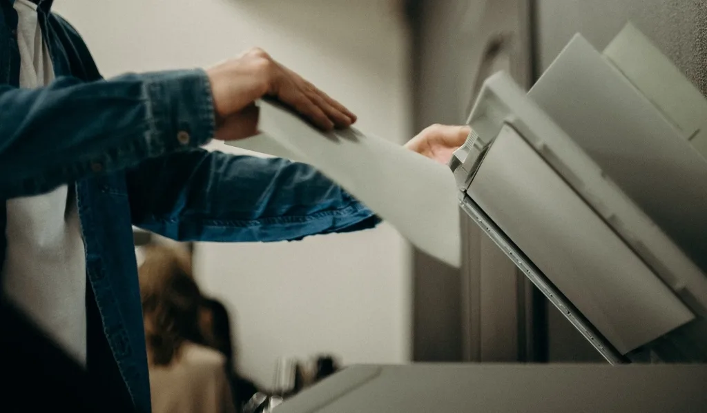 man using photocopier