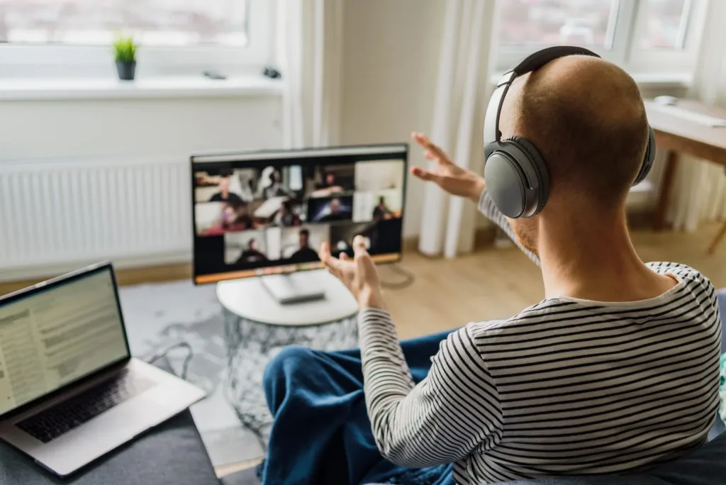 Man having video call with colleagues