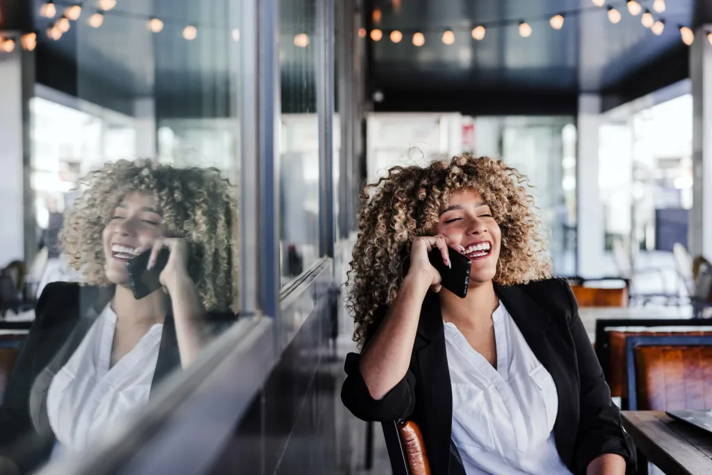 smiling woman on a business mobile