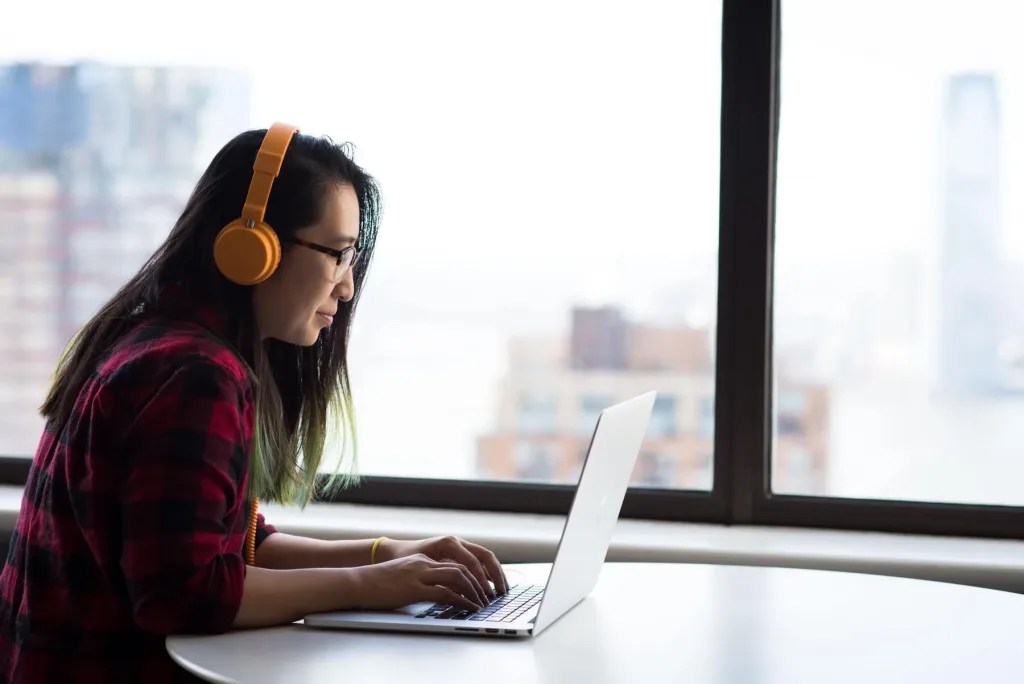 woman on laptop video call using VoIP technology